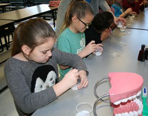 picture of fourth graders mixing up toothpaste