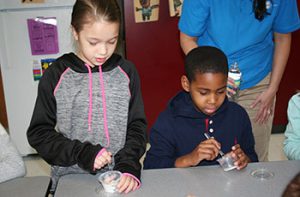 picture of students mixing toothpaste