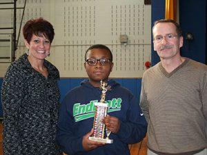 picture of spelling bee runner up holding trophy