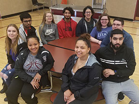 picture of Class of 2019 top 10 students seated around a table in cafeteria