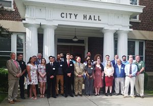 picture of students and Watervliet city officials standing in front of City Hall