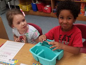 picture of kindergarten students practicing letters 