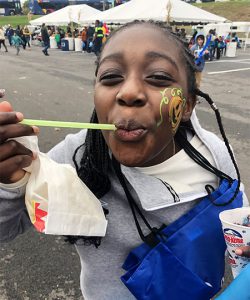 picture of student with pumpkin painted on face