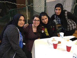 picture of students at table with English as a New Language teacher