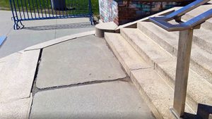 picture of cracks in sidewalk and stairs at main entrance to Watervliet Elementary School