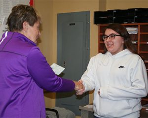 picture of top prize winner shaking hands with Elks rep