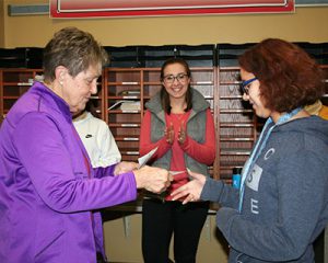 picture of second place winner in essay contest shaking hands with Elks rep