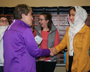 picture of third place winner shaking hands with Elks rep