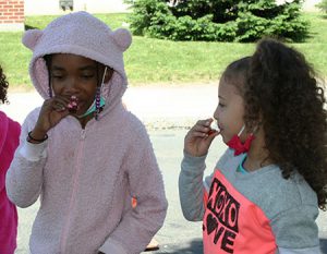 picture of students sampling pure maple syrup