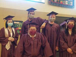 picture group of five graduates