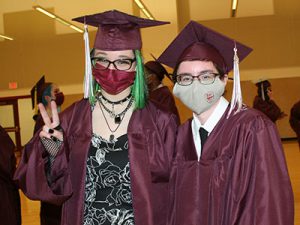 picture of two graduates standing next to each other