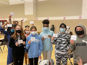 picture of group of students holding up special lunch tickets