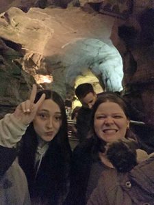 picture of two students smiling while taking a tour of Howe Caverns