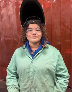 Watervliet student wears a protective welding helmet and goggles at Capital Region BOCES Career and Technical Education Center.