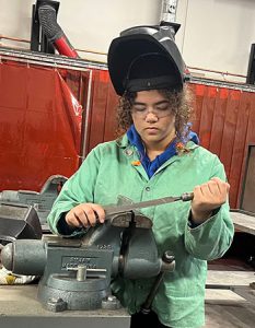 Watervliet student works with metal fabrication equipment in a Capital Region BOCES Career and Technical Education Center classroom. 