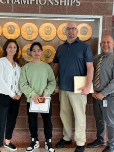 Bausch and Lomb Honorary Science Award winning student stands with high school principal, science teacher and guidance counselor after award presentation