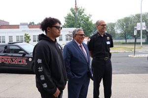 The mayor and the police chief welcome a high school senior to Youth Day in Watervliet