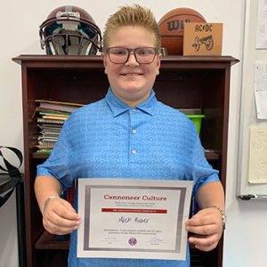 Grade 6 Be Positive Student of the Month for September holds award certificate