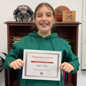 Grade 8 Be Positive Student of the Month for September holds award certificate