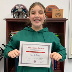 Grade 8 Be Positive Student of the Month for September holds award certificate