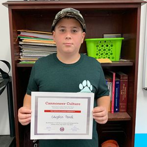 Grade 6 Be Present Student of the Month for September holds award certificate