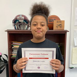 Grade 7 Be Productive Student of the Month for September holds award certificate