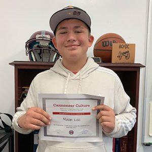 Grade 8 Be Productive Student of the Month for September holds award certificate