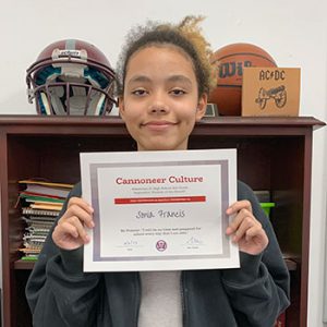 Grade 8 Be Present Student of the Month for September holds award certificate