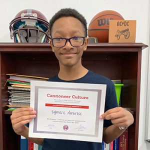 Grade 7 Be Present Student of the Month for September holds award certificate