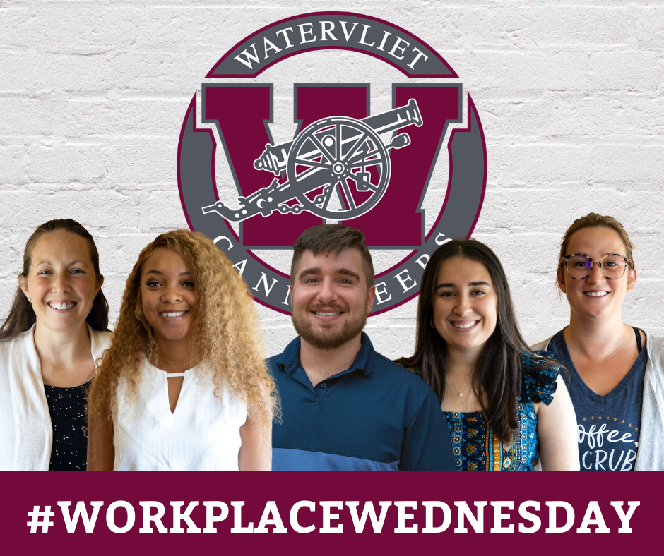 new staff members in front of brick wall with Watervliet logo... text on-screen: #WorkplaceWednesday