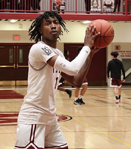 Watervliet basketball player catches the ball while facing the camera