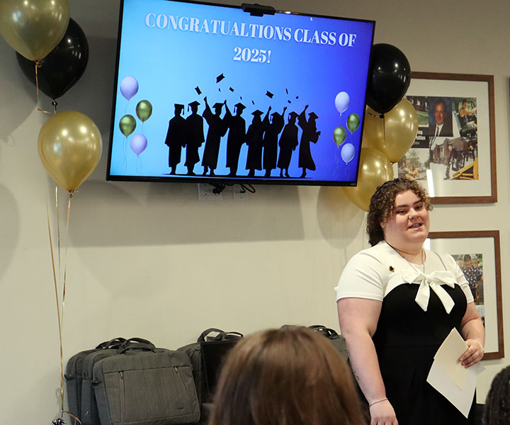 RPI graduate and Watervliet High School alum speaks to attendees of the laptop ceremony