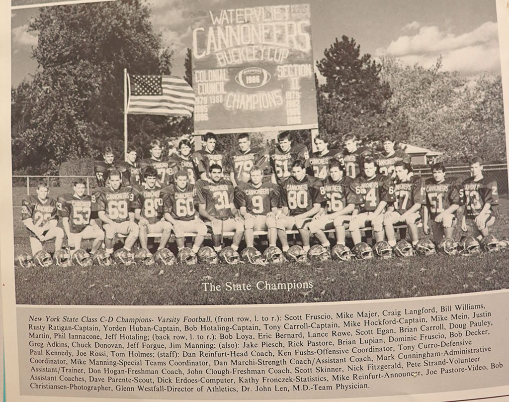 Yearbook image depicts the 1991 championship football Team on the field