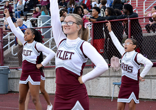 Cheerleaders with arms up