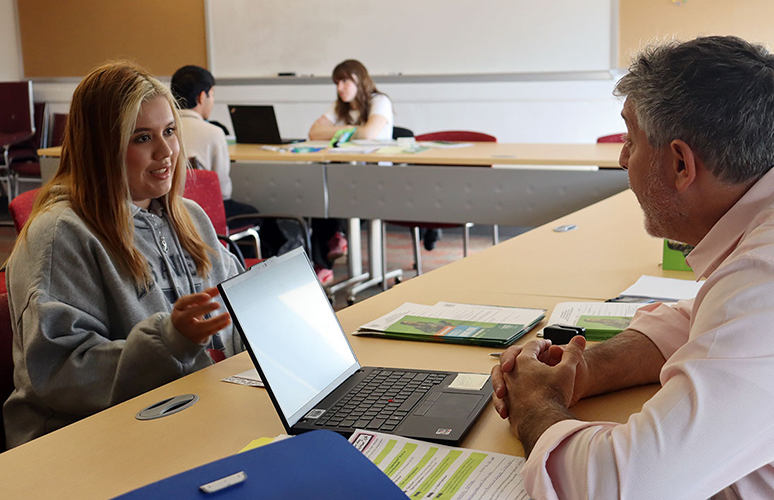 Student meets with an admissions counselor