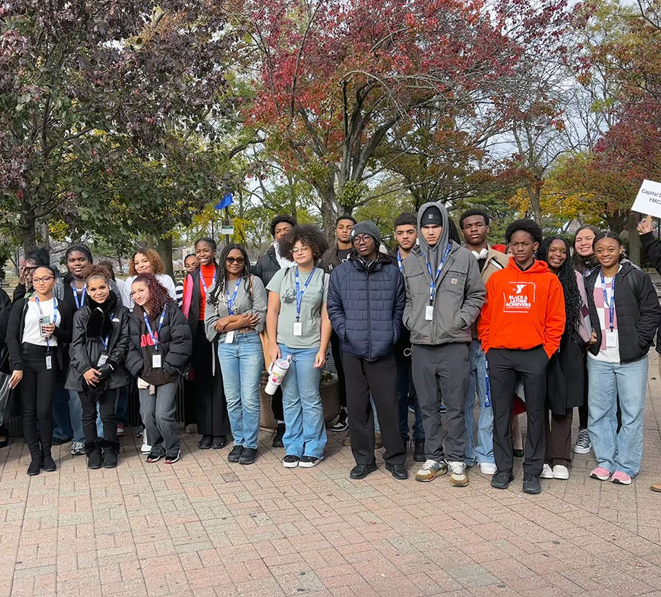 Group of 15 students stand together at the HBCU College Fair in New York City