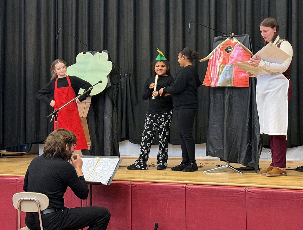 Group of students dressed in costume perform a skit