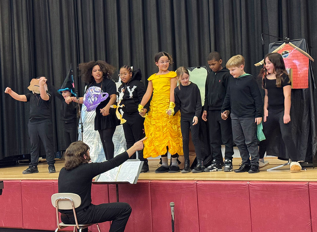 Group of students dressed in costume perform a skit