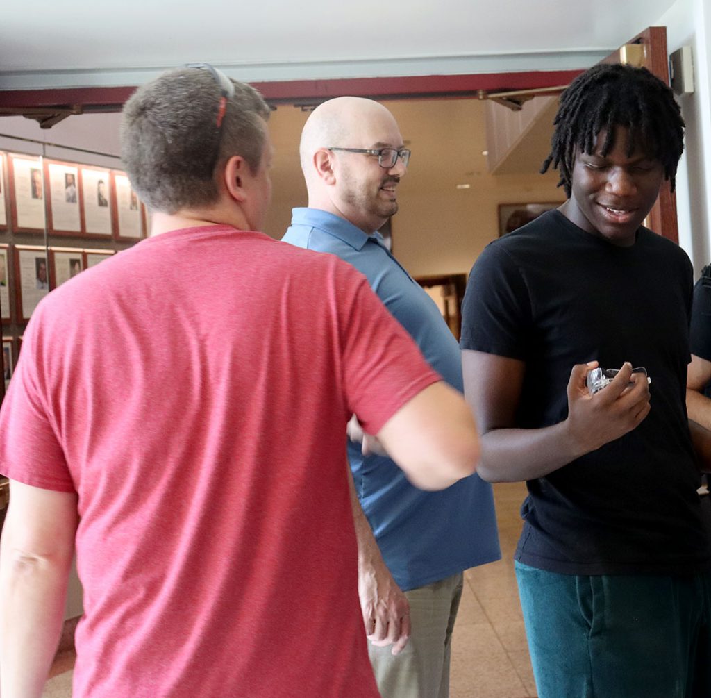 Science and technology teachers congratulate student on scholarship award